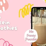 A bright, colorful graphic banner with abstract pink, yellow, and blue shapes. Text reads "High Protein Smoothies" and "No Fancy Powder." On the right, a phone screen shows a tall glass filled with a thick, brown smoothie.