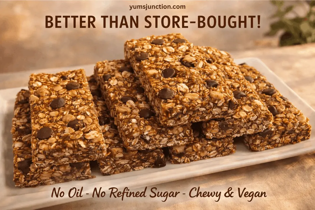 A stack of thick, rectangular granola bars filled with rolled oats and dark chocolate chips on a white rectangular plate. The image has a warm, golden tone. Text at the top reads "yumsjunction.com" and "BETTER THAN STORE-BOUGHT!" Text at the bottom says "No Oil - No Refined Sugar - Chewy & Vegan."