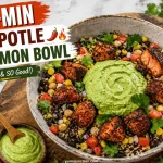 A promotional food graphic titled "30-Min Chipotle Salmon Bowl" showing a bowl of charred salmon cubes, black beans, corn, and quinoa topped with a large swirl of green sauce. A gold fork lifts a piece of flaky salmon with website name written at the bottom Yum Junction