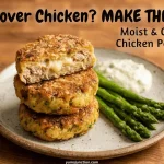 A horizontal promotional graphic featuring a stack of three crispy chicken patties. The top patty is broken open to reveal a juicy, moist interior with melted cheese. The dish is garnished with roasted asparagus and sauce on a rustic wooden surface. Includes the brand name Yum Junction and the URL.