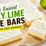 Easy key lime pie bars recipe showing a thick square bar being lifted on a spatula with pale yellow custard filling golden vanilla wafer crust and whipped cream topping sprinkled with lime zest alongside fresh limes on parchment