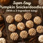 Super easy pumpkin snickerdoodle cookies on a wire cooling rack drizzled with white icing surrounded by mini pumpkins cinnamon sticks star anise and a jar of pumpkin spice on a dark wood background