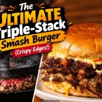 Burger press smashing beef in a smoking cast iron skillet next to a finished triple stack smash burger